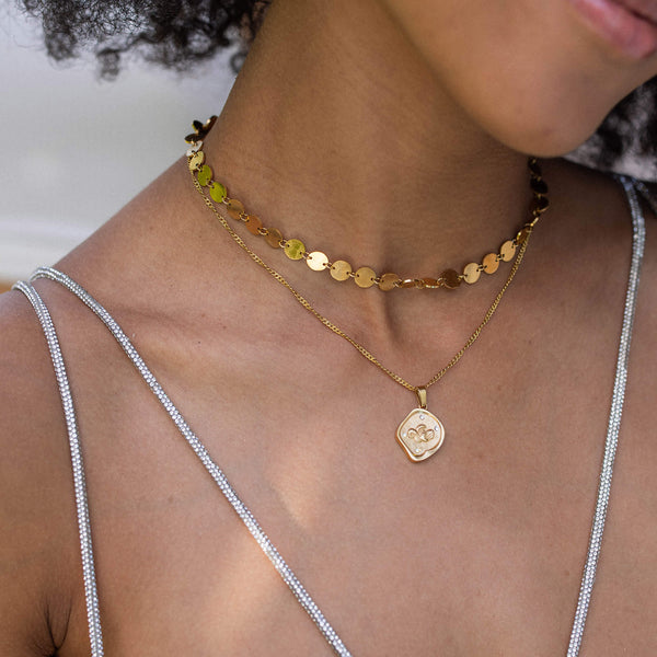 Charm a forma di moneta Wave