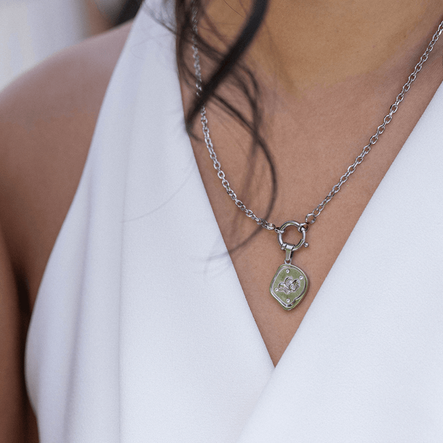 Charm a forma di moneta Wave